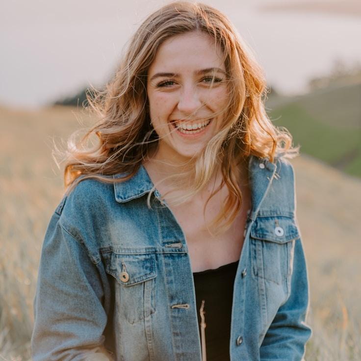 Avery Singh, Lead Design Curator at Tranquil Forest Path, reviewing corporate floral arrangements
